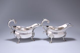 A PAIR OF GEORGE III SILVER SAUCE BOATS, LONDON 1773, maker's mark indistin