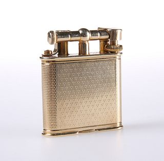 AN ALFRED DUNHILL 9 CARAT GOLD LIGHTER, LONDON 1932, the engine-turned case