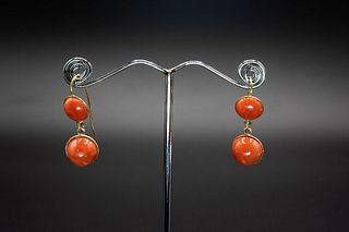 A PAIR OF CORAL EARRINGS, the two graduating round coral beads each set in 
