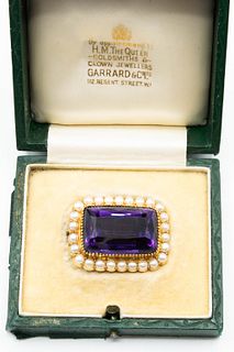 AN AMETHYST AND CULTURED PEARL BROOCH, the large rectangular cut amethyst s