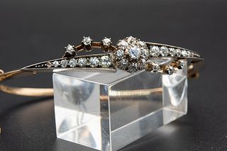 A LATE 19TH CENTURY DIAMOND SET BANGLE, the spilt detail tapering mount wit
