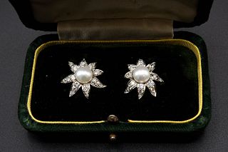 A PAIR OF CULTURED PEARL AND DIAMOND EARRINGS, the abstract flower head sha
