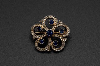 A MID 19TH CENTURY OLD CUT DIAMOND BROOCH, of scrolling coiled mounts set t