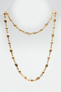 A 9CT YELLOW GOLD NECKLACE CHAIN, of polished and textured metal beads, on 