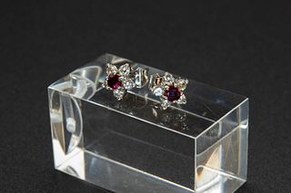 A PAIR OF RUBY AND DIAMOND EARRINGS BY MAPPIN AND WEBB, the single round cu