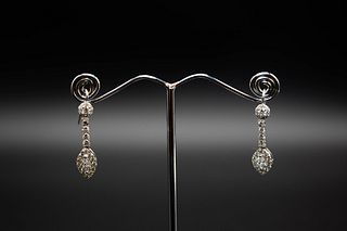 A PAIR OF DIAMOND EARRINGS, the marquise cut diamond set with a surround of