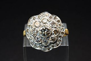 A DIAMOND CLUSTER RING, the flower head cluster set throughout with graduat