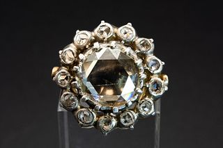 A GEORGIAN DIAMOND RING, the large central rose cut diamond within a surrou