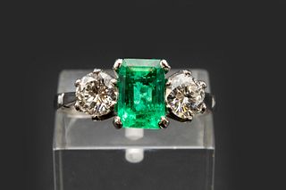 A COLOMBIAN EMERALD AND DIAMOND RING, the square cut emerald set between tw