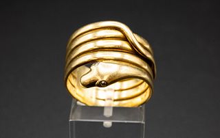 AN 18CT YELLOW GOLD RING, coiled to depict a snake, the slightly raised hea