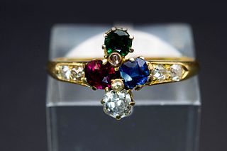 AN 18CT YELLOW GOLD AND GEM SET RING, the mount comprising of a round cut d