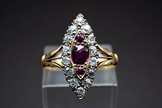 A 19TH CENTURY RUBY AND DIAMOND RING, the navette shaped mount set to the c
