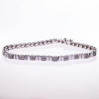 AN 18CT WHITE GOLD AND DIAMOND BRACELET, the square shaped links set altern