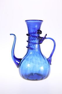 A BLUE GLASS EWER, PROBABLY VENETIAN, 19TH CENTURY, with wrythen moulded bo