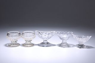 FIVE GEORGE III AND LATER CUT-GLASS SALTS, comprising a pair of circular sa