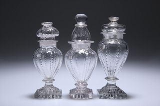 THREE ENGLISH GLASS CONDIMENT BOTTLES AND STOPPERS, CIRCA 1800, each with "