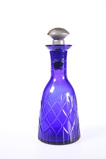 A LATE VICTORIAN CUT BLUE GLASS LIQUEUR DECANTER, of shaped mallet form, wi