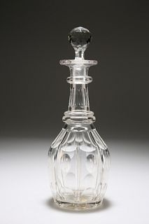 A CUT-GLASS BARREL-SHAPED DECANTER, with faceted ball stopper over a panel-