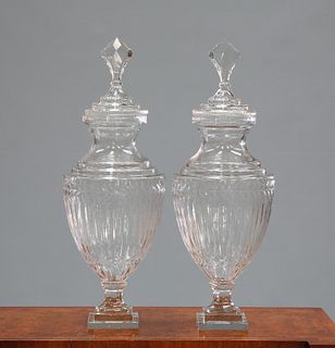 A LARGE PAIR OF ADAM STYLE GLASS URNS AND COVERS, with stepped square base 