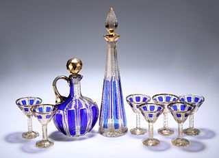 A 19TH CENTURY BOHEMIAN BLUE-OVERLAID AND GILDED CUT-GLASS LIQUEUR SET, com