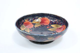 A MOORCROFT POTTERY POMEGRANATE PATTERN FRUIT BOWL, tubelined and painted a