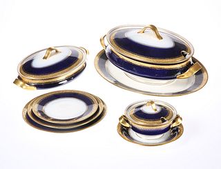 A HANDSOME AND EXTENSIVE LIMOGES COBALT BLUE AND GILT DINNER AND COFFEE SER