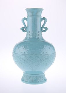 A CHINESE TURQUOISE GLAZED VASE, the globular moulded body issuing a neck a