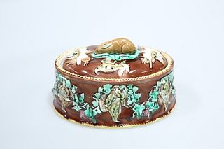 A WEDGWOOD MAJOLICA GAME PIE DISH, oval, the cover with rabbit finial and m