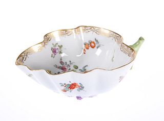 A DRESDEN LEAF-SHAPED PICKLE DISH, painted with a floral spray and sprigs w