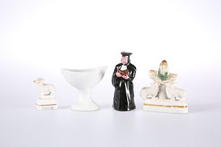 A 19TH CENTURY POTTERY FIGURAL CANDLE SNUFFER IN THE FORM OF A PRIEST, toge