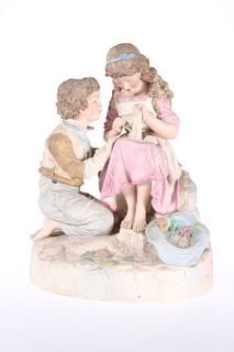 A ROBINSON & LEADBEATER TINTED PARIAN GROUP OF TWO CHILDREN, picked out in 