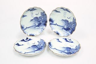 A GOOD SET OF FOUR ARITA BLUE AND WHITE DISHES, each scalloped plate painte