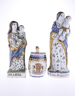TWO 19th CENTURY QUIMPER POTTERY FIGURES OF THE VIRGIN, each modelled holdi
