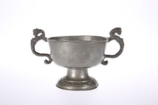 A PEWTER TWO-HANDLED CUP, PROBABLY 18TH CENTURY, raised on a domed foot cas