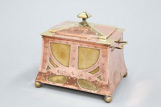 AN ARTS AND CRAFTS COPPER AND BRASS COAL BOX, the domed top with crown fini