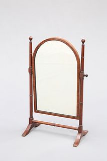 A REGENCY MAHOGANY TOILET MIRROR, with arch top and ring moulded uprights. 