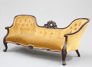 A VICTORIAN ROSEWOOD SETTEE, with buttoned double-hump back carved and pier
