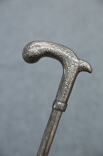 AN INDIAN SILVER INLAID AND NIELLO DECORATED WALKING STICK, of three screw-