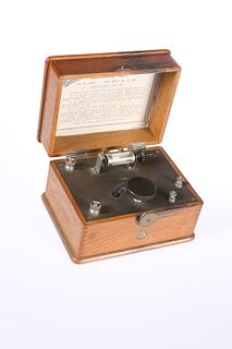 A WIRELESS ERICSSON BBC CRYSTAL RADIO RECEIVER, oak cased. 20cm wide