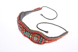 A TIBETAN BUDDHIST BELT, decorated with turquoise and coral stones. 63cm