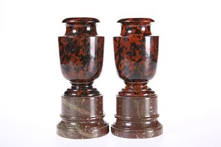 A PAIR OF 19TH CENTURY SERPENTINE VASES, the urns raised on a contrasting m
