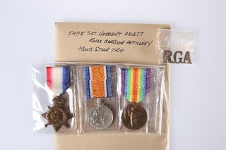 A WORLD WAR I MONS STAR TRIO AND BADGE, 5498 Sgt. Herbert Aslett, Royal Gar