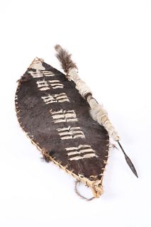 TRIBAL: A ZULU COW HIDE SHIELD AND STABBING SPEAR. (2)