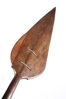 TRIBAL: A SOUTH SEA ISLANDS PADDLE, the pointed blade with incised tracery.