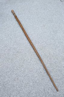 TRIBAL: A CHIEFTAIN'S STAFF, with carved handle, retaining some basket weav
