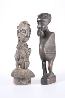 TRIBAL: TWO CARVED FIGURES, one of them modelled riding an animal. Taller 2