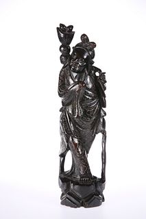 A JAPANESE SILVER INLAID HARDWOOD FIGURE, EARLY 20TH CENTURY, carved wearin