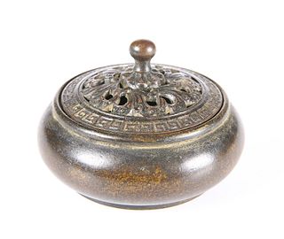 A CHINESE BRONZE CENSER, of squat circular form with pierced cover, the cov