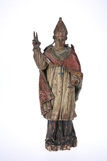 A CONTINENTAL CARVED POLYCHROME WOODEN FIGURE OF A BISHOP, PROBABLY 18th CE