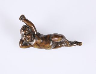 A BRONZE OF A WAKING PUTTO, possibly 18th Century. 7.5cm